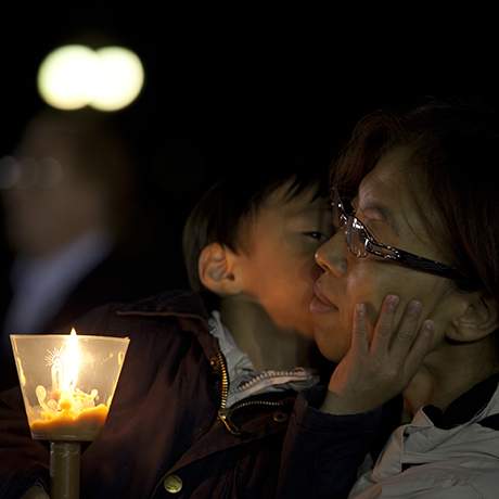 Mother with child in the candlelight procession, Shrine of Fatima